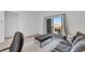 Inviting living room with balcony access, featuring stylish furniture and a serene atmosphere for relaxation at 234 Walsh Peak Ave, Henderson, NV 89015