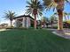 Grand entrance with stone accents and lush landscaping, creating a welcoming community atmosphere at 293 Caddy Bag Ct, Las Vegas, NV 89148