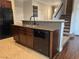 Kitchen island with granite countertops, stainless steel sink, and modern appliances, offering a functional and stylish workspace at 293 Caddy Bag Ct, Las Vegas, NV 89148