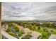 Expansive Las Vegas view showcases lush landscaping, nearby golf course, and a panoramic mountain backdrop at 3111 Bel Air Dr # 15D, Las Vegas, NV 89109