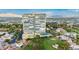 Expansive aerial view of the tower, showcasing its community pool, tennis court, golf course, and gardens at 3111 Bel Air Dr # 15D, Las Vegas, NV 89109