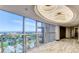 Balcony featuring city views, marble floors, a modern railing, and decorative light fixtures at 3111 Bel Air Dr # 15D, Las Vegas, NV 89109