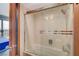 Modern bathroom featuring a tiled shower and tub with glass door at 3111 Bel Air Dr # 15D, Las Vegas, NV 89109
