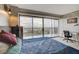 Bright bedroom features large windows offering city views, a desk, and stylish decor at 3111 Bel Air Dr # 15D, Las Vegas, NV 89109
