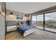 Bright bedroom featuring a cityscape view and balcony access at 3111 Bel Air Dr # 15D, Las Vegas, NV 89109