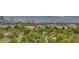 Panoramic city view showcasing lush trees, neighboring buildings, and distant mountain ranges at 3111 Bel Air Dr # 15D, Las Vegas, NV 89109