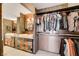 Spacious walk-in closet with clothing racks and ample storage space at 3111 Bel Air Dr # 15D, Las Vegas, NV 89109