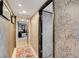 Hallway with wallpapered walls, artwork, and access to other rooms, creating a cohesive flow at 3111 Bel Air Dr # 15D, Las Vegas, NV 89109