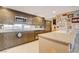 Updated kitchen with stainless steel appliances, granite countertops, and mountain views at 3111 Bel Air Dr # 15D, Las Vegas, NV 89109
