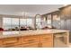 Modern kitchen featuring granite countertops, stainless steel appliances, and scenic views at 3111 Bel Air Dr # 15D, Las Vegas, NV 89109