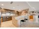 Open kitchen with granite countertops, seating, and ample cabinet space at 3111 Bel Air Dr # 15D, Las Vegas, NV 89109