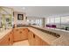 Bright kitchen featuring granite countertops and a beautiful view at 3111 Bel Air Dr # 15D, Las Vegas, NV 89109