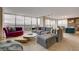 Spacious living room with large windows offering panoramic views, modern furniture, and plenty of room at 3111 Bel Air Dr # 15D, Las Vegas, NV 89109