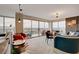 Open living area with large windows providing scenic city views, stylish furniture, and lots of natural light at 3111 Bel Air Dr # 15D, Las Vegas, NV 89109