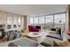 Modern living room featuring plush seating, stylish decor, and expansive windows with city views at 3111 Bel Air Dr # 15D, Las Vegas, NV 89109