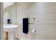 Modern powder room with pedestal sink, designer wallpaper, and chrome fixtures at 322 Karen Ave # 2206, Las Vegas, NV 89109