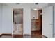 Hallway leading to a bathroom with tub and walk-in closet with wooden drawers at 322 Karen Ave # 2206, Las Vegas, NV 89109