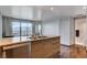 Granite countertop kitchen island with stainless steel dishwasher and wood cabinets at 322 Karen Ave # 2206, Las Vegas, NV 89109