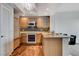 Modern kitchen with wood cabinets, stainless steel appliances, and granite countertops at 322 Karen Ave # 2206, Las Vegas, NV 89109