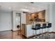 A modern kitchen features stainless steel appliances, an island with bar seating and an in-unit washer/dryer at 322 Karen Ave # 2206, Las Vegas, NV 89109