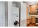 Washer and dryer laundry closet with a modern kitchen view at 322 Karen Ave # 2206, Las Vegas, NV 89109