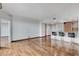 An open-concept living room features hardwood floors and a modern kitchen with bar stool seating at 322 Karen Ave # 2206, Las Vegas, NV 89109