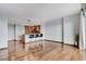 An open-concept living room features hardwood floors, a modern kitchen and abundant natural light from the large windows at 322 Karen Ave # 2206, Las Vegas, NV 89109