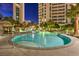 Beautiful view of the large pool area featuring rock waterfall and luxury lounge seating at 322 Karen Ave # 2206, Las Vegas, NV 89109