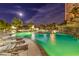Spacious pool area with inviting lounge chairs and a charming waterfall feature, perfect for relaxation at 322 Karen Ave # 2206, Las Vegas, NV 89109