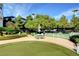 View of putting green and patio area featuring outdoor dining table at 322 Karen Ave # 2206, Las Vegas, NV 89109