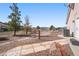 Backyard with stone walkway, desert landscaping, and a view of neighboring houses at 3581 Ranger Way, Pahrump, NV 89048