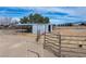 Outdoor barn structure with metal roof and horse fencing in a desert landscape, perfect for equestrian activities at 3581 Ranger Way, Pahrump, NV 89048
