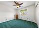 Bright bedroom with a ceiling fan, window, and a closet at 3581 Ranger Way, Pahrump, NV 89048