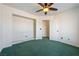 Bright and spacious bedroom featuring plush green carpet and a walk-in closet at 3581 Ranger Way, Pahrump, NV 89048