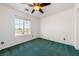 Comfortable bedroom with a ceiling fan and natural light from the window at 3581 Ranger Way, Pahrump, NV 89048