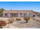 Single-story home with a covered carport, desert landscaping, and mountain views on a sunny day at 3581 Ranger Way, Pahrump, NV 89048