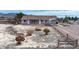 Charming single-story home featuring a covered parking area and low-maintenance landscaping, nestled with mountain views at 3581 Ranger Way, Pahrump, NV 89048