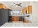 Well-lit kitchen featuring stainless steel appliances, ample cabinet space, and a window overlooking the outdoors at 3581 Ranger Way, Pahrump, NV 89048
