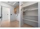 Bright laundry room with built-in shelves and cabinet at 3581 Ranger Way, Pahrump, NV 89048