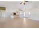 Open-concept living area with tile floors, breakfast bar, and smooth transitions to the kitchen and entry at 3581 Ranger Way, Pahrump, NV 89048