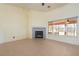 Bright living room featuring tile flooring and a fireplace with natural lighting at 3581 Ranger Way, Pahrump, NV 89048