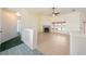 Bright living room featuring tile flooring, fireplace, hallway access and natural lighting at 3581 Ranger Way, Pahrump, NV 89048