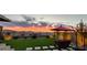 Enjoy the evening on the beautiful backyard patio with artificial turf and colorful sunset views at 394 Red Feather Peak Ct, Las Vegas, NV 89138