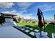 Beautiful backyard featuring artificial turf, stone pavers, and lush landscaping, perfect for outdoor enjoyment at 394 Red Feather Peak Ct, Las Vegas, NV 89138