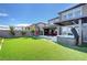 Beautiful backyard with outdoor seating and a hot tub, perfect for entertaining and relaxation at 394 Red Feather Peak Ct, Las Vegas, NV 89138
