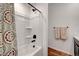 Bright bathroom showcasing a shower with bronze fixtures and a patterned shower curtain at 394 Red Feather Peak Ct, Las Vegas, NV 89138