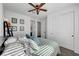 Comfortable bedroom featuring a ceiling fan, double bed and plenty of natural light at 394 Red Feather Peak Ct, Las Vegas, NV 89138