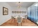 A well-staged dining room features hardwood floors, bright natural light, and modern decor at 394 Red Feather Peak Ct, Las Vegas, NV 89138