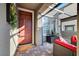 Inviting entryway with a stylish front door and comfortable patio seating at 394 Red Feather Peak Ct, Las Vegas, NV 89138