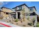 Attractive home with a paved driveway, attached garage, and low-maintenance front yard at 394 Red Feather Peak Ct, Las Vegas, NV 89138